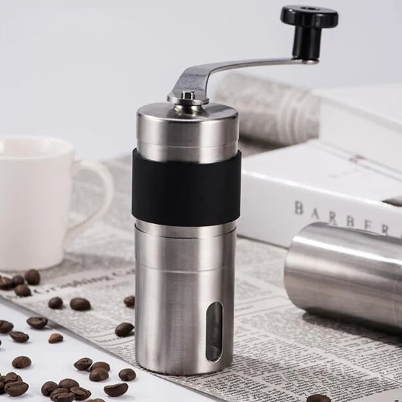 Compact and portable Manual Mini Stainless Steel Coffee Grinder, designed for travel and home use, with a durable stainless steel body and adjustable grind settings for a customized coffee experience.